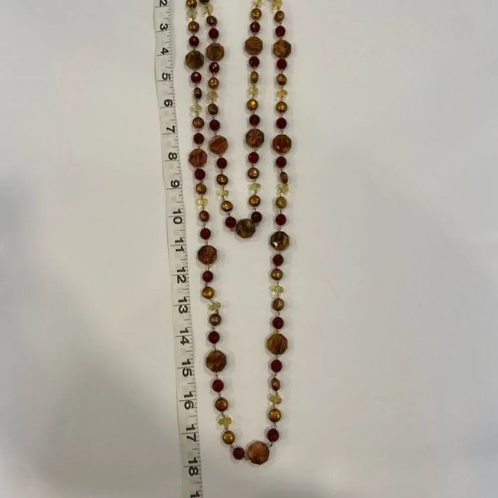 Double strand necklace Unique blend of beads and pearls. Toggle closure